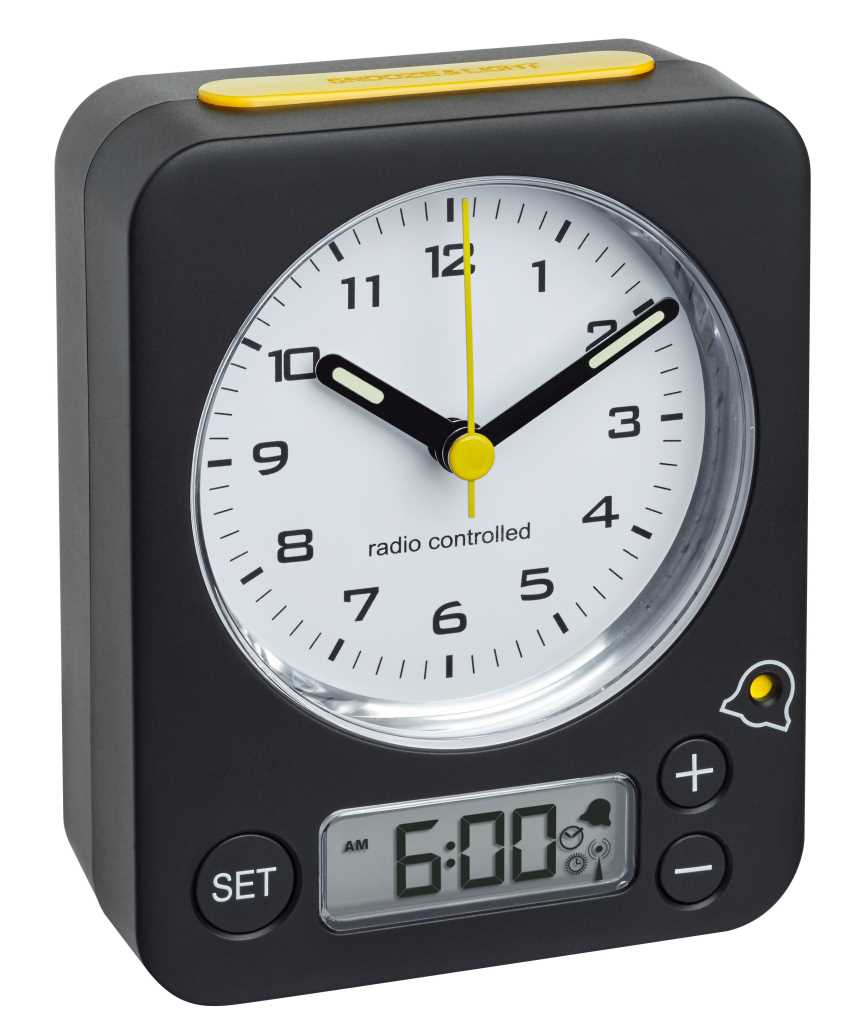 Schwarzer Wecker mit analogem Zifferblatt, gelbem Sekundenzeiger, Snooze-Taste oben und Digitalanzeige 6:00 unten