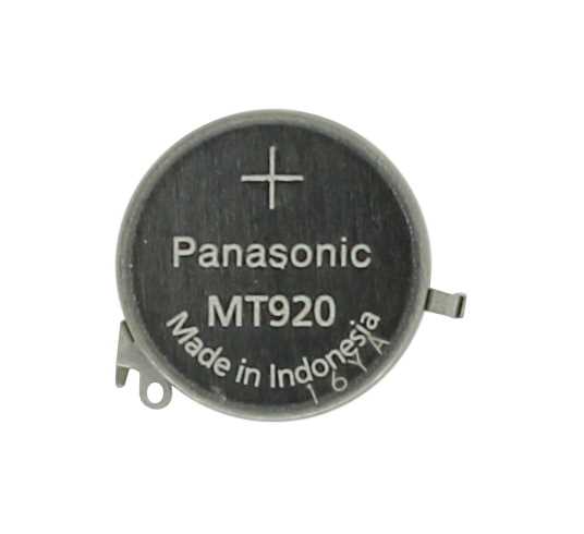 Runde Knopfzelle mit Pluszeichen und zwei seitlichen Laschen auf weißem Hintergrund