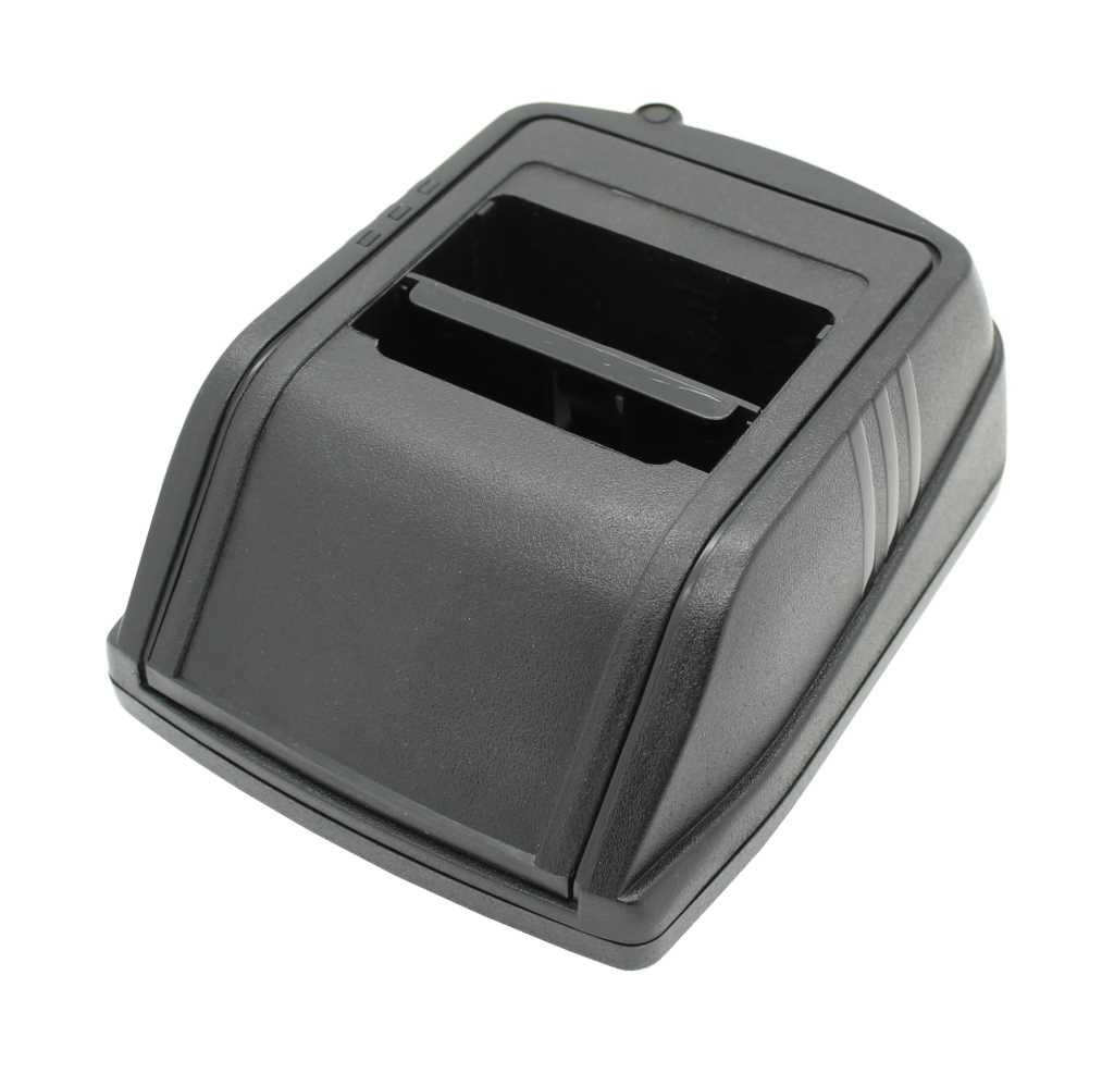 Schwarze Kunststoff-Ladeschale mit rechteckiger Aussparung und seitlichen Rillen, schräg von oben fotografiert